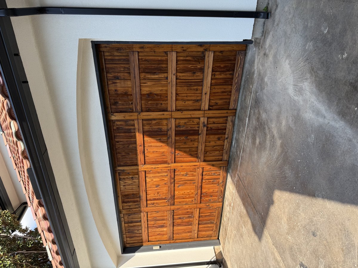 Stained wood double garage door