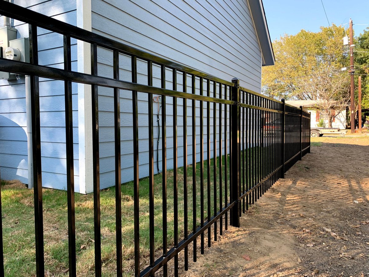 Black wrought iron fence installation
