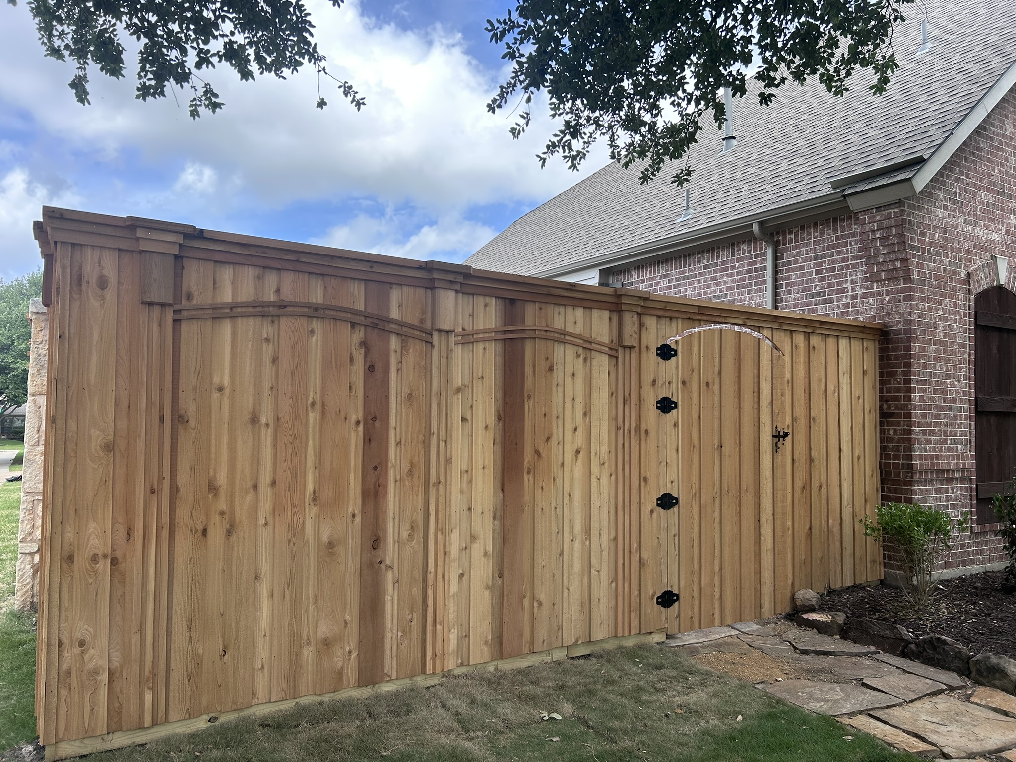 New cedar privacy fence and double arched gate with black hardware