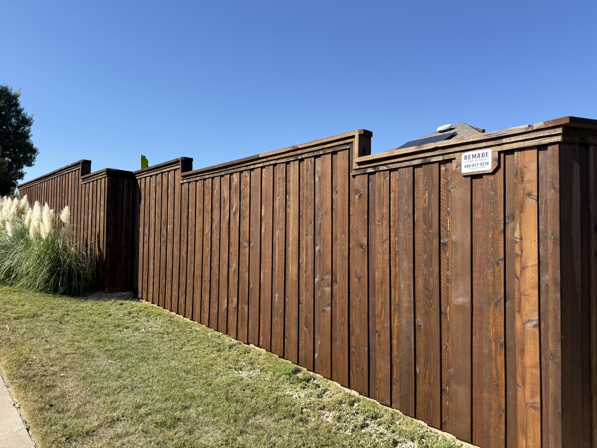 New unstained cedar board-on-board fence and gate in narrow side yard
